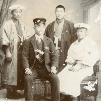 Four Japanese men in occupational clothing